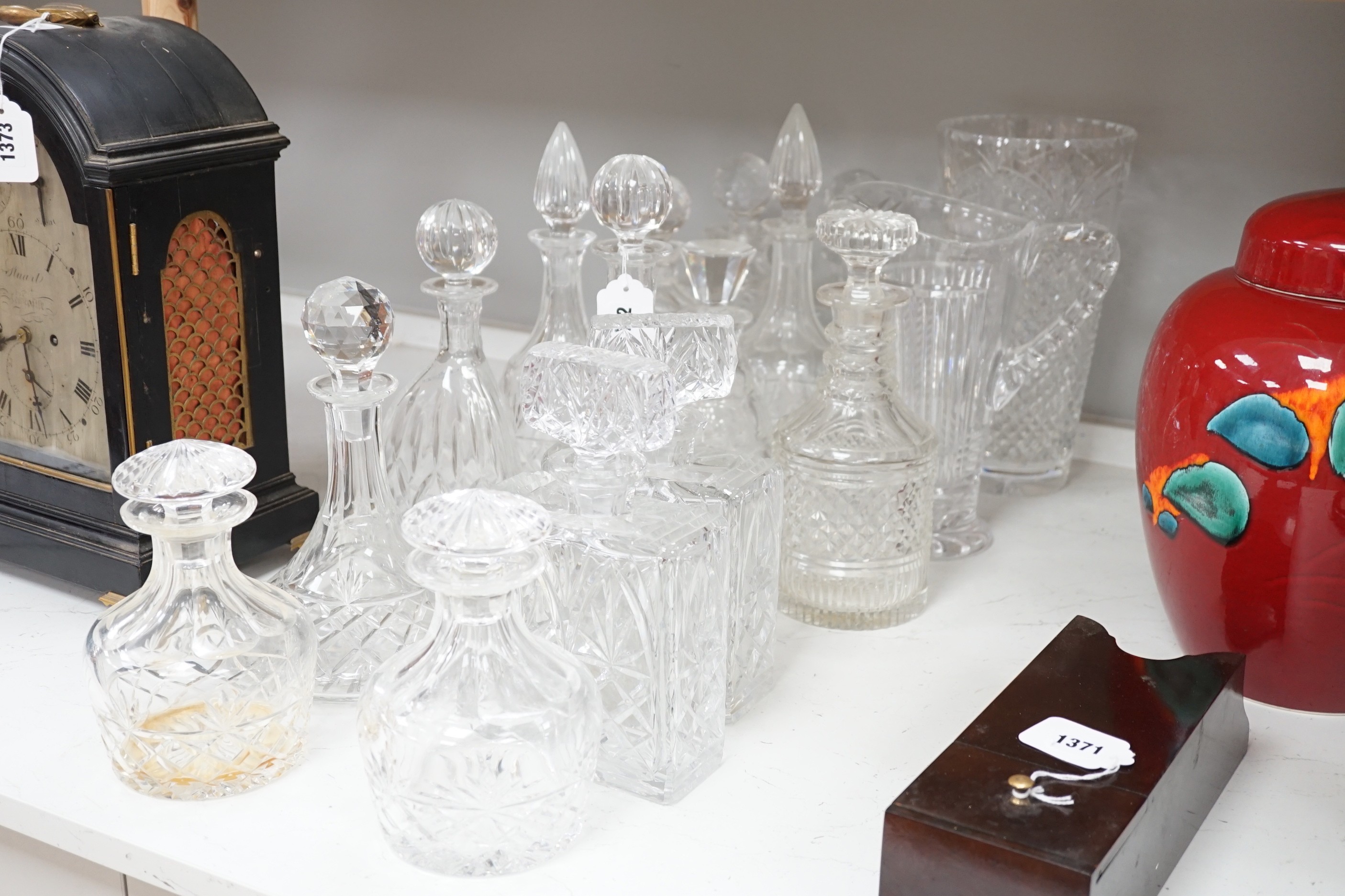 A group of assorted glass decanters and two vases